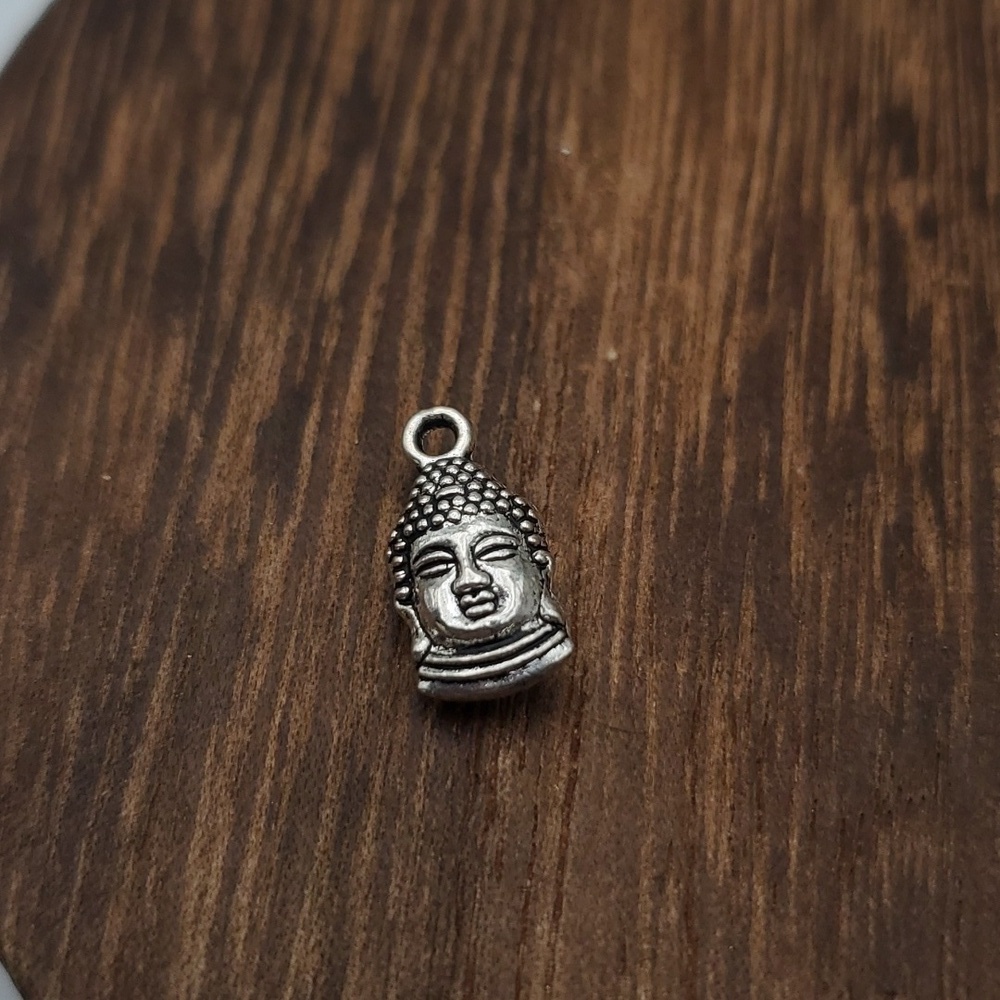 Tibetan Buddha sterling silver charm‎
